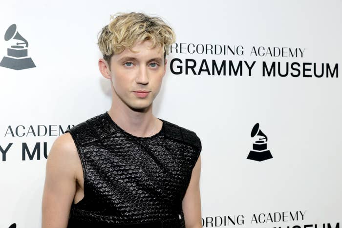 Troye Sivan at the Recording Academy Grammy Museum event, wearing a sleeveless, textured top