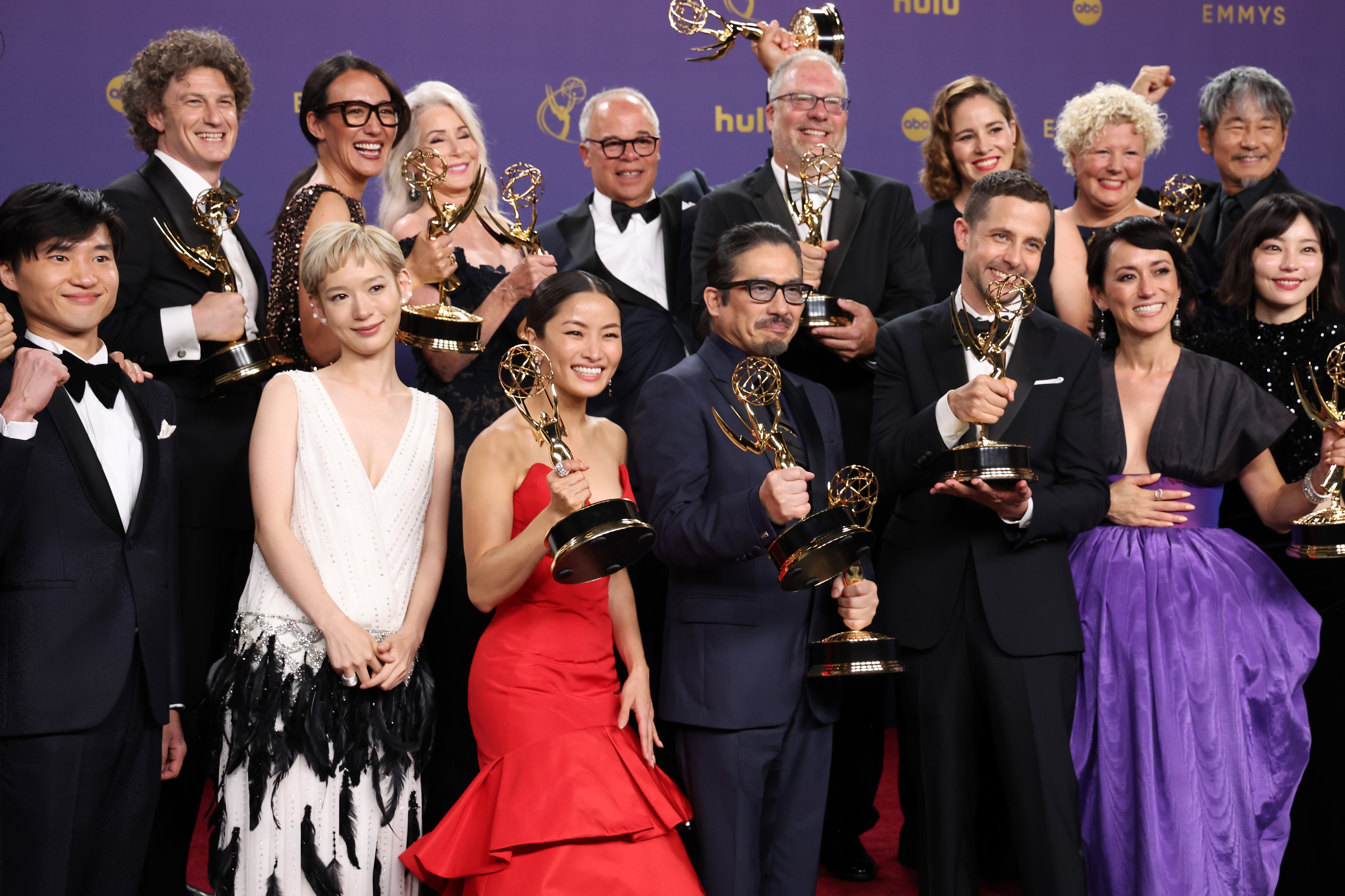 The cast and crew of Shōgun standing backstage with their Emmy awards