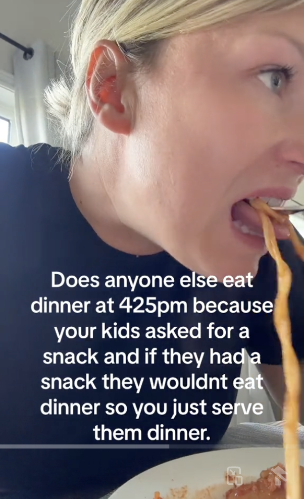 Close-up of a person eating spaghetti with the text: "Does anyone else eat dinner at 4:25pm because your kids asked for a snack and if they had a snack they wouldn't eat dinner so you just serve them dinner?"