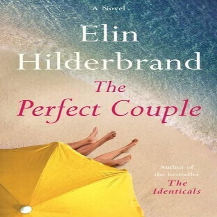 Book cover for "The Perfect Couple" by Elin Hilderbrand, showing two pairs of feet under a yellow beach umbrella on a sandy shore