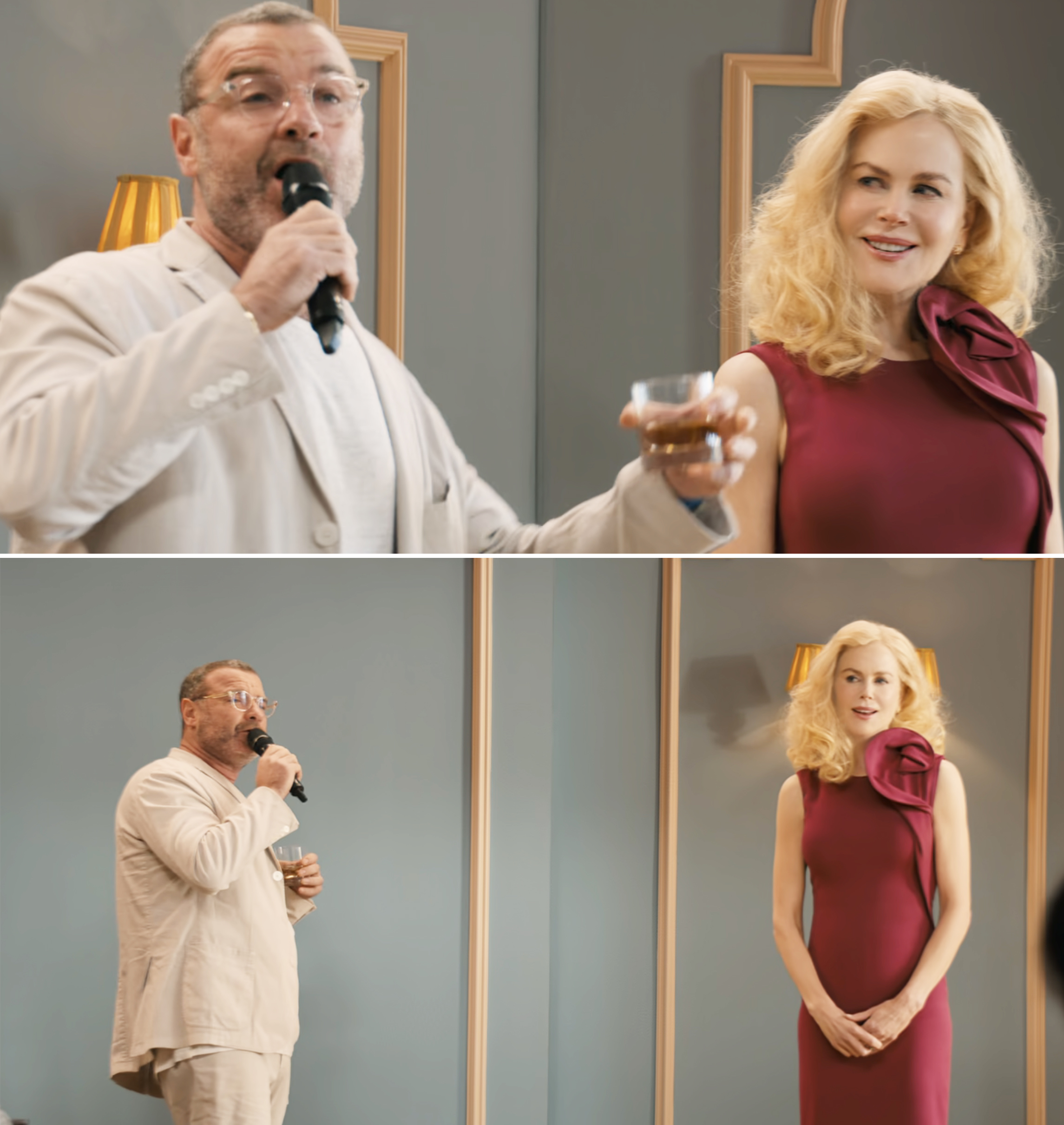 Liev Schreiber, in a beige suit, singing into a microphone while holding a drink. Nicole Kidman, in an elegant sleeveless dress with a floral detail, stands beside him