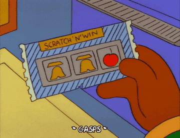 A character from The Simpsons holds a winning scratch-off ticket, revealing two lemons and a cherry. The bottom text reads "* GASPS *"