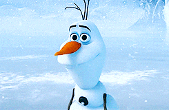 Olaf from Frozen is in a snowy landscape, smiling and slightly moving
