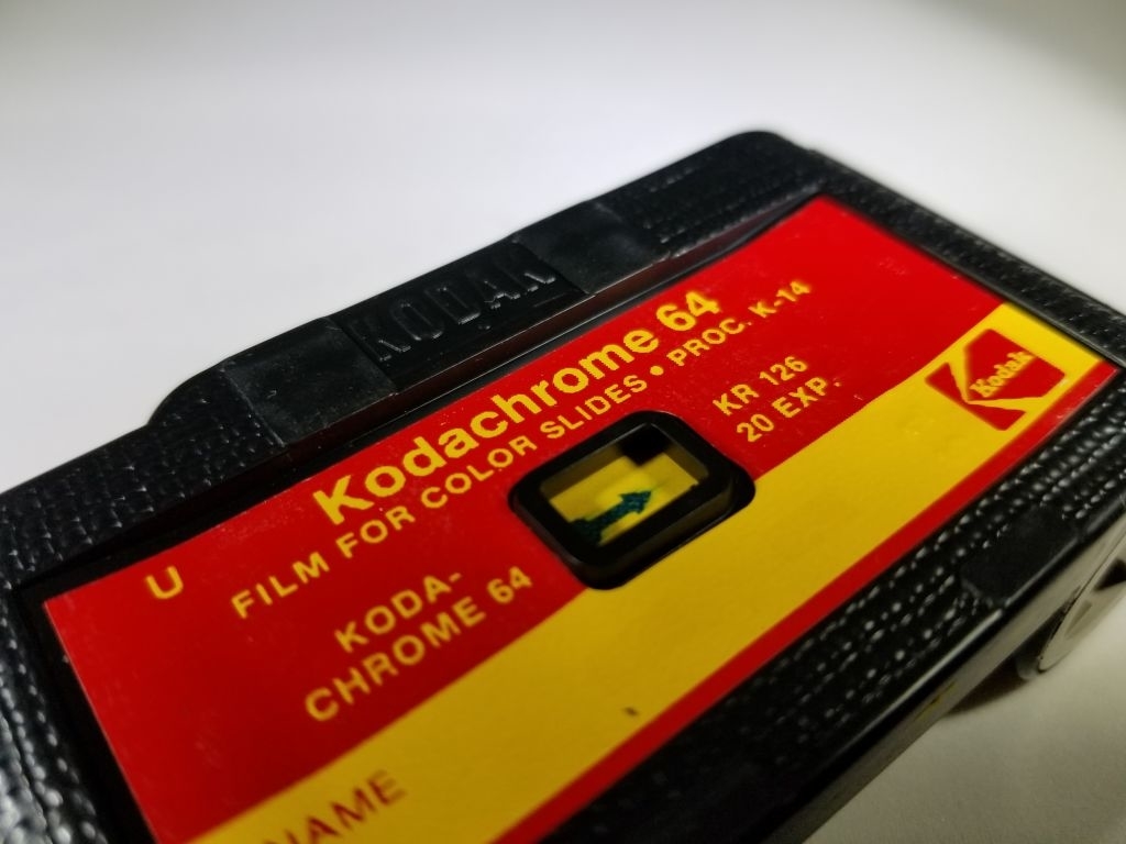 Close-up of a Kodak Kodachrome 64 film box labeled "Kodachrome 64, film for color slides, process K-14, KR 126, 20 EXP."