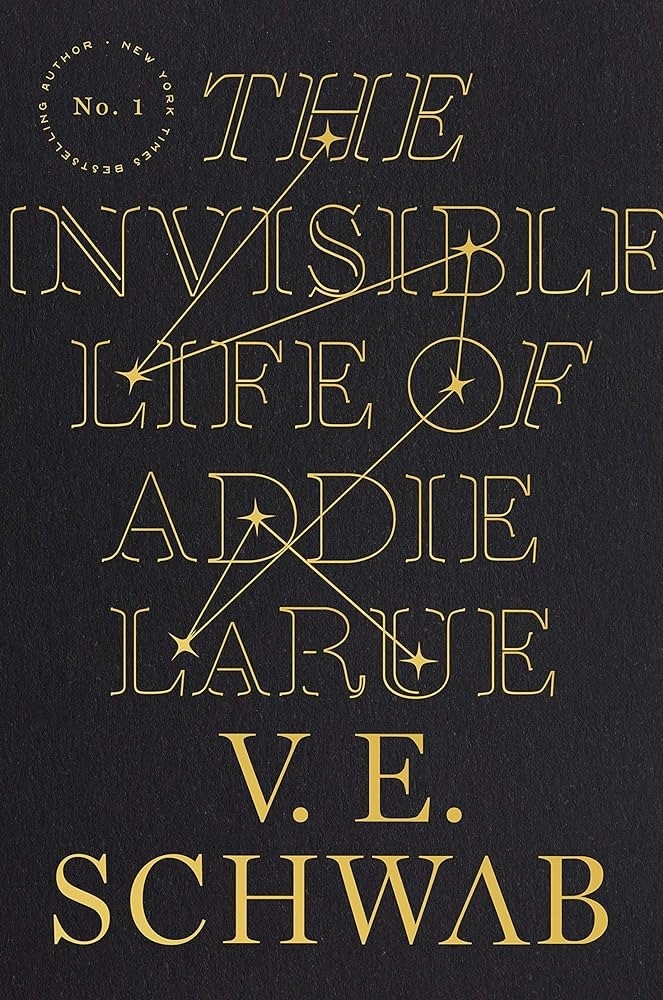 Book cover of "The Invisible Life of Addie LaRue" by V.E. Schwab. The text includes various interspersed star-like designs