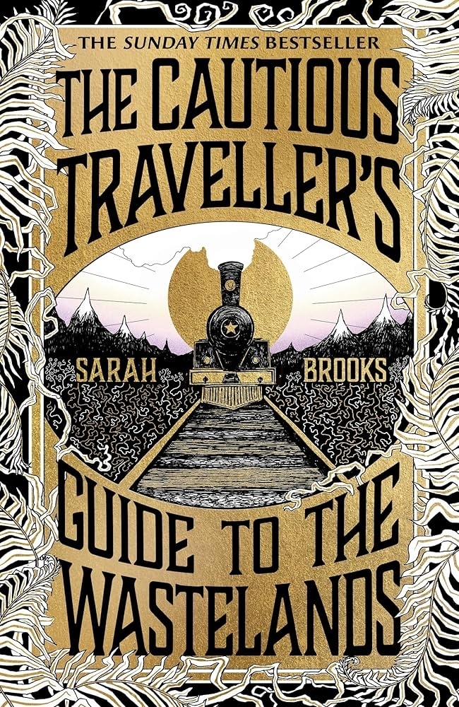 Book cover reading "The Cautious Traveller's Guide to the Wastelands" by Sarah Brooks, with an illustration of a train on tracks heading into a wasteland