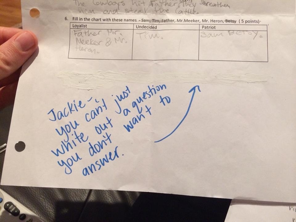 A hand holding a paper with an exercise on categorizing names into Loyalist, Undecided, or Patriot. A handwritten note reads, "Jackie, you can’t just white out a question you don’t want to answer." An arrow points to the whiteout