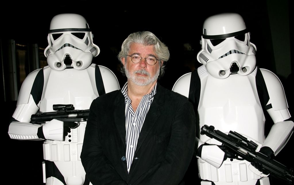 George Lucas stands between two Stormtroopers