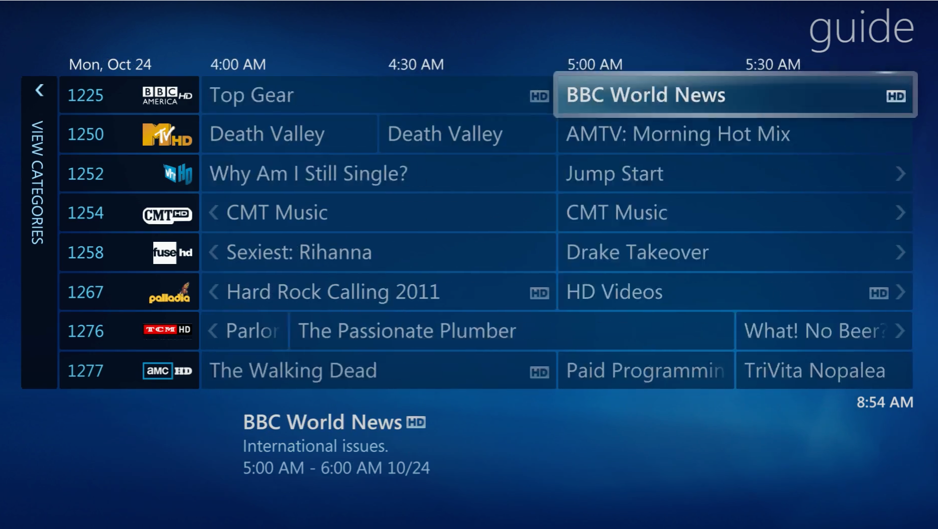 TV guide displaying program listings including BBC World News, Top Gear, Death Valley, Drake Takeover, CMT Music, and more with times from 4:00 AM to 5:30 AM