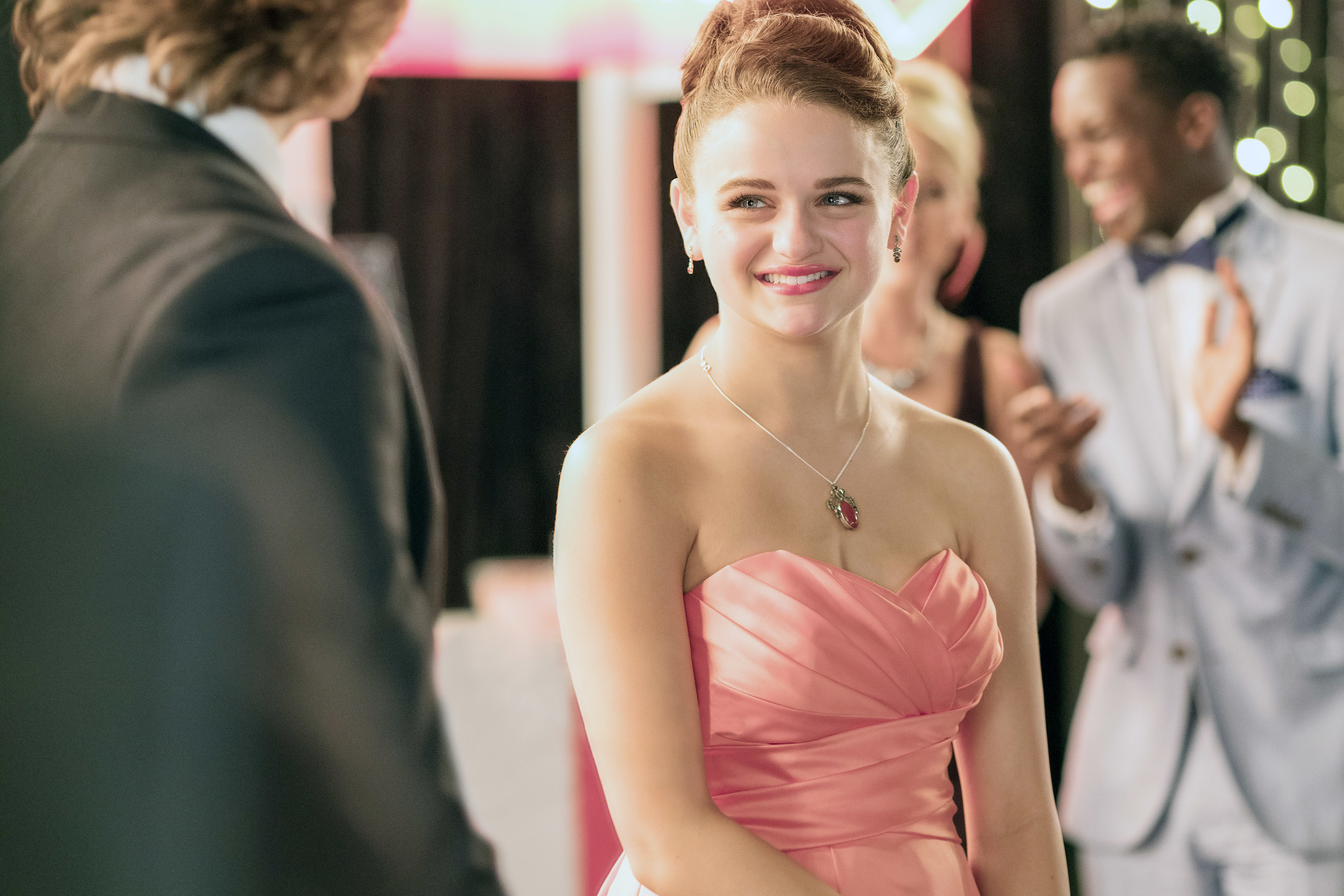 Joey King in a pink strapless dress in "The Kissing Booth"