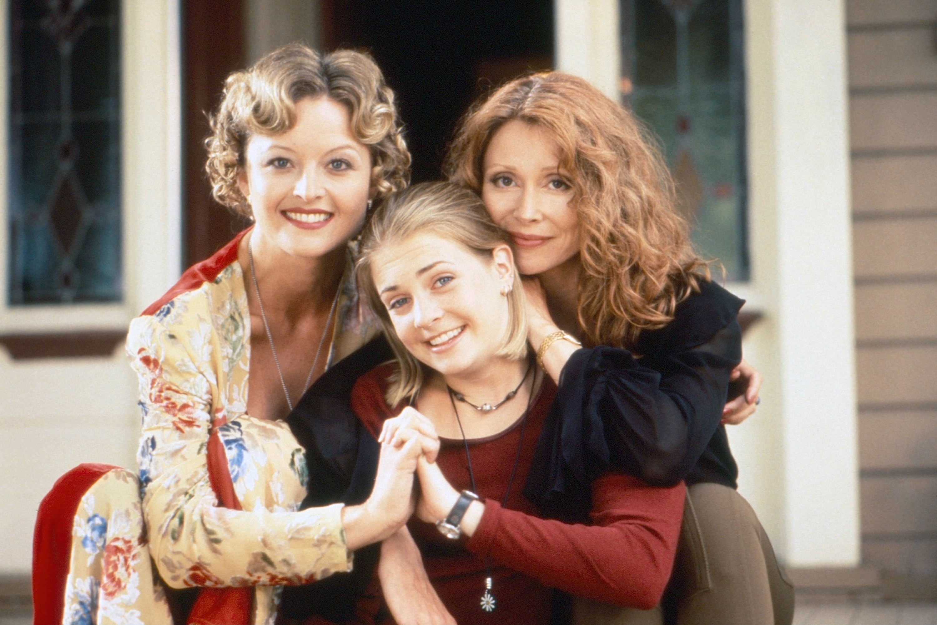 Charlene Fernetz, Melissa Joan Hart, and Sherry Miller taking a family photo together in "Sabrina the Teenage Witch"