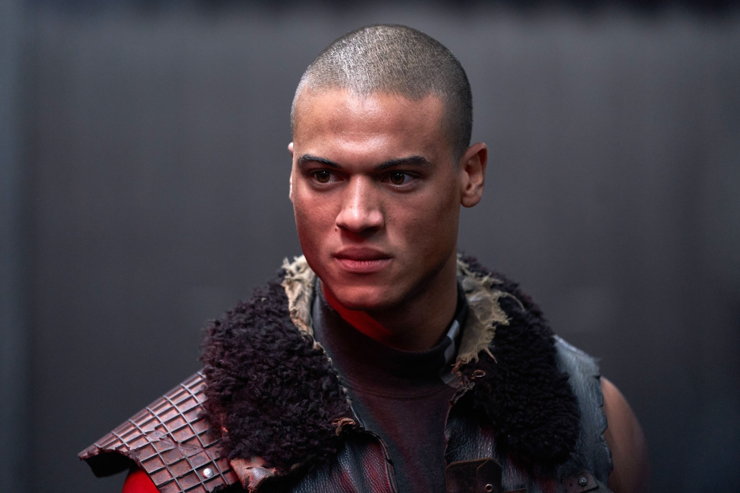 Jan Luis Castellanos wearing a vest made with various materials in "Uglies"