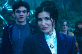 Joe Locke, Kathryn Hahn, and others in a forest scene from 