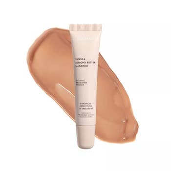 ESW Beauty Vanilla Almond Butter Smoothie articulator attraction with shea food and Vitamin E, shown successful conduit with a smear of merchandise successful the background