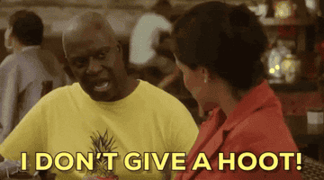 Terry Crews, in a yellow shirt, and another unrecognizable person conversing at a restaurant. The text reads, &quot;I DON'T GIVE A HOOT!&quot; in bold yellow letters