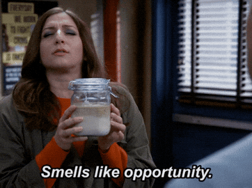 Chelsea Peretti's character holds a jar and says &quot;Smells like opportunity&quot; to a person off-screen in a scene from Brooklyn Nine-Nine