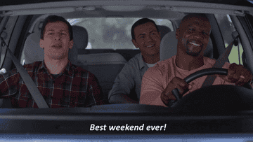 Andy Samberg, Joe Lo Truglio, and Terry Crews are in a car with Terry driving and Andy excitedly exclaiming &quot;Best weekend ever!&quot;
