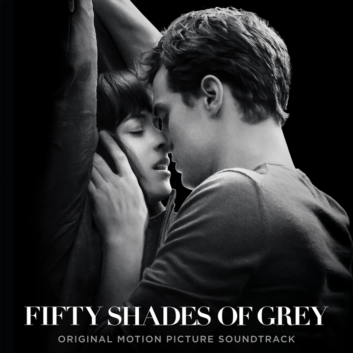 Dakota Johnson and Jamie Dornan intimately close, with arms raised, on the "Fifty Shades of Grey" original motion picture soundtrack cover