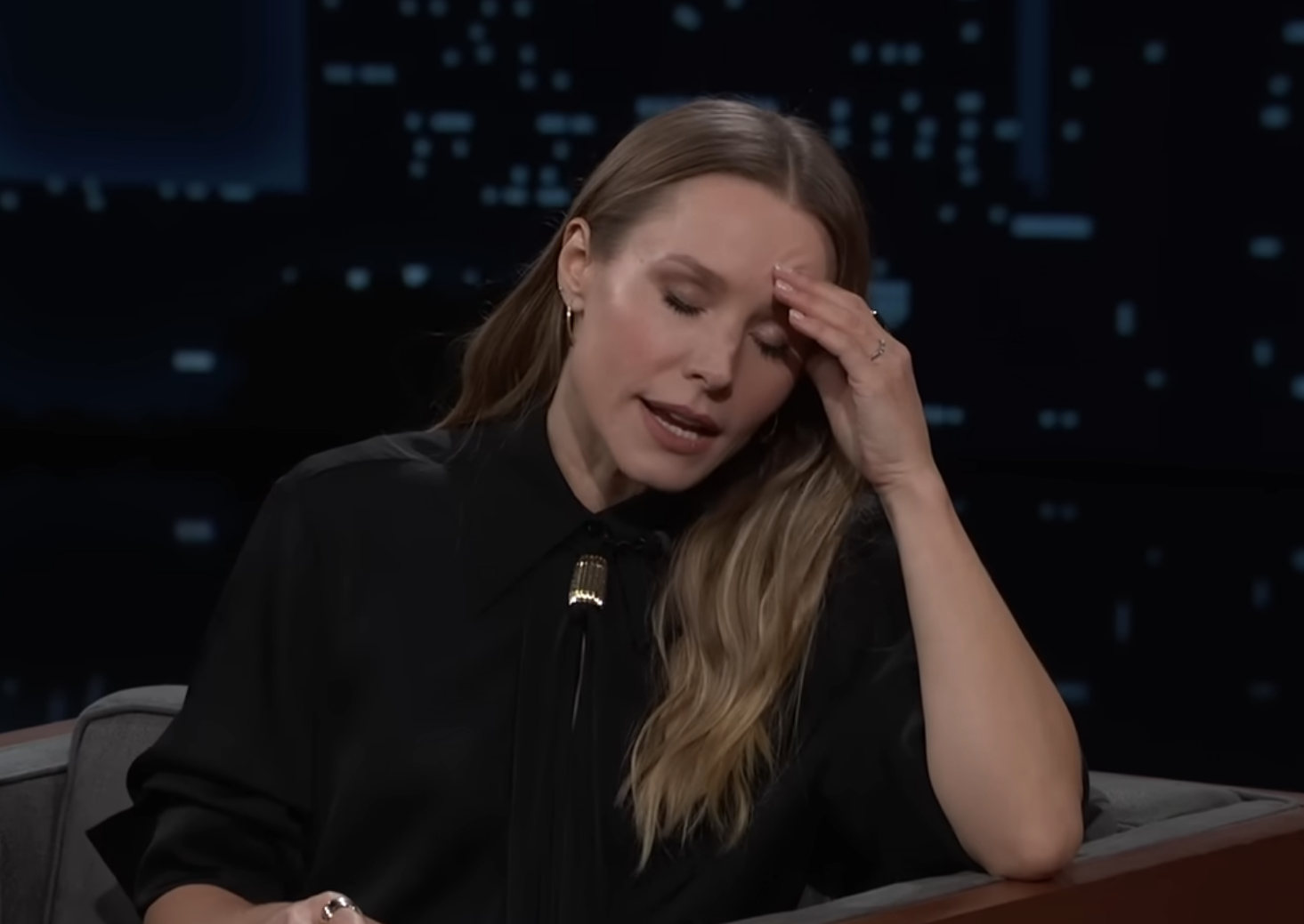Kristen Bell on Jimmy Kimmel Live, resting her head in her hand, discussing taking her husband Dax home, their kids loving Denmark, and vacationing with Jimmy