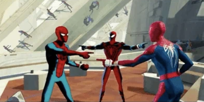 Spider-Men from Spider-Man: Into the Spider-Verse pointing at each other in a room full of futuristic technology