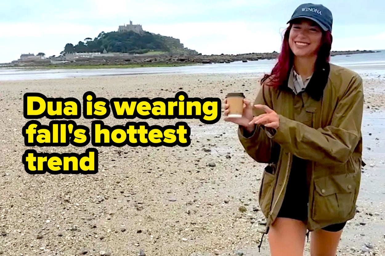 dua lipa in a barn coat with caption "dua is wearing fall's hottest trend
