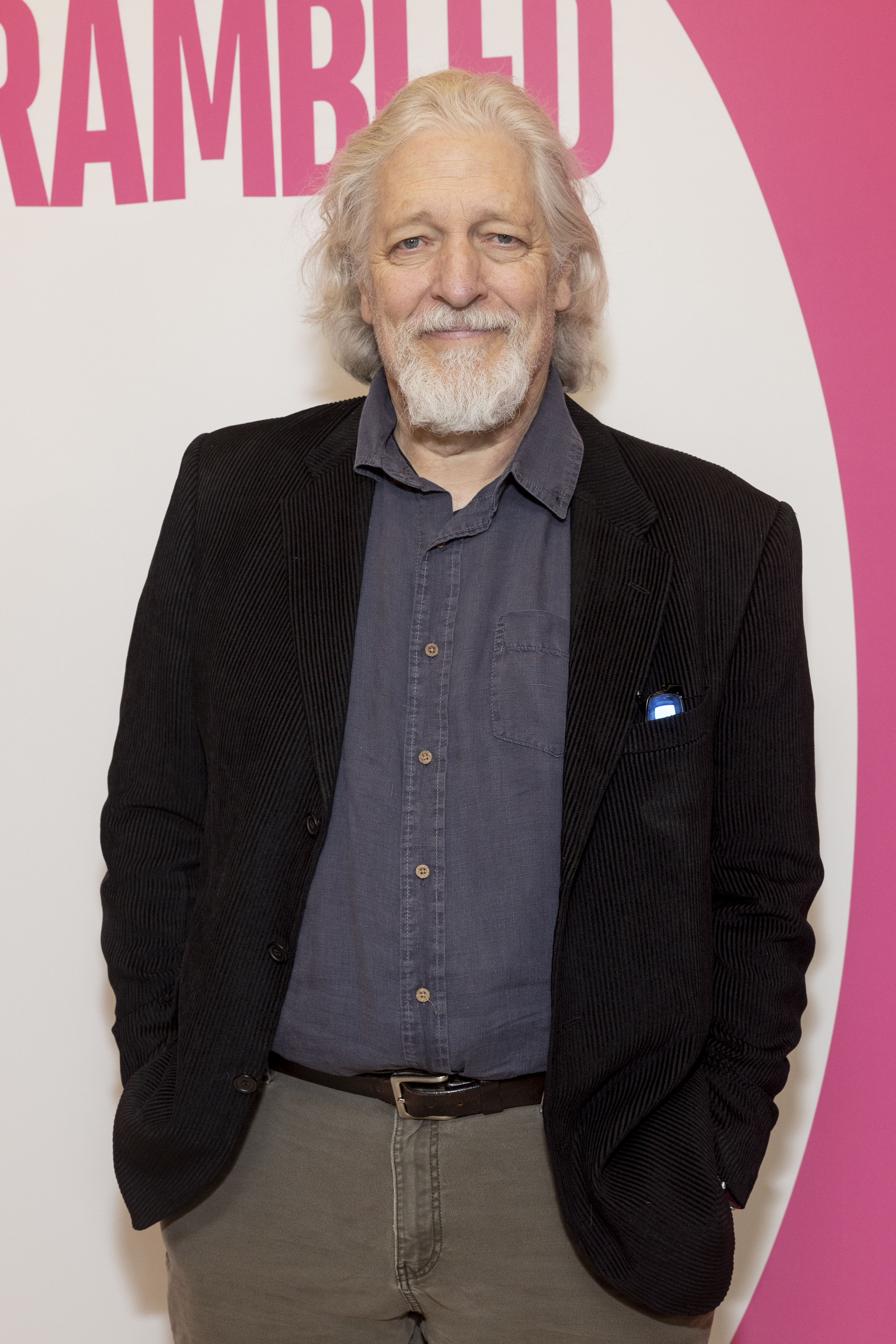 Clancy Brown in a casual shirt and dark blazer attends a promotional event