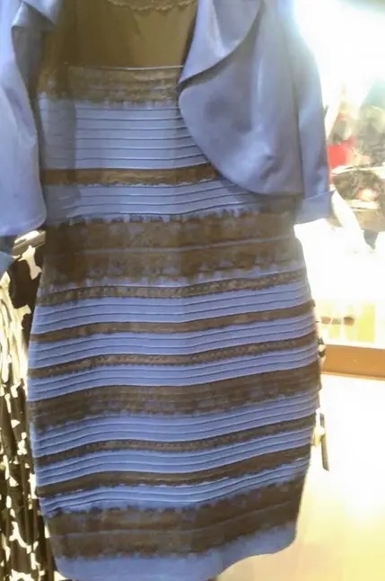 Blue and black dress hanging in a store, famously known from the internet debate over whether the dress is perceived as black and blue or white and gold