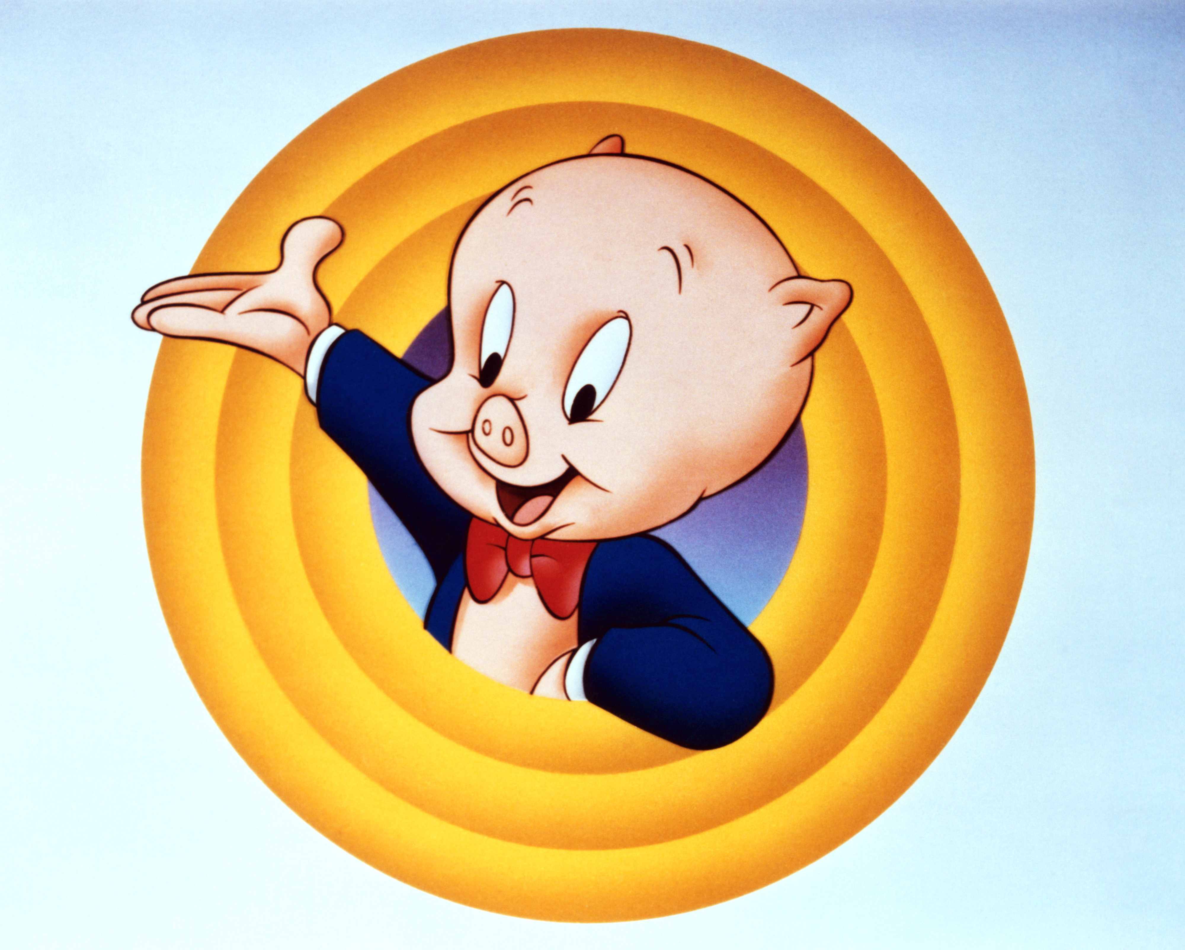 Porky Pig, an animated character, is seen in a classic end scene pose with his arm raised, wearing a suit and bow tie, in a concentric circle backdrop