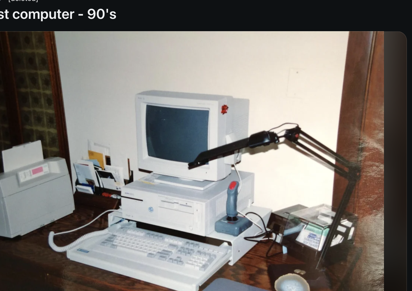 Reddit post by u/nostalgia with an image of a 1990s computer setup. The image includes a monitor, keyboard, printer, joystick, and floppy disks on a desk