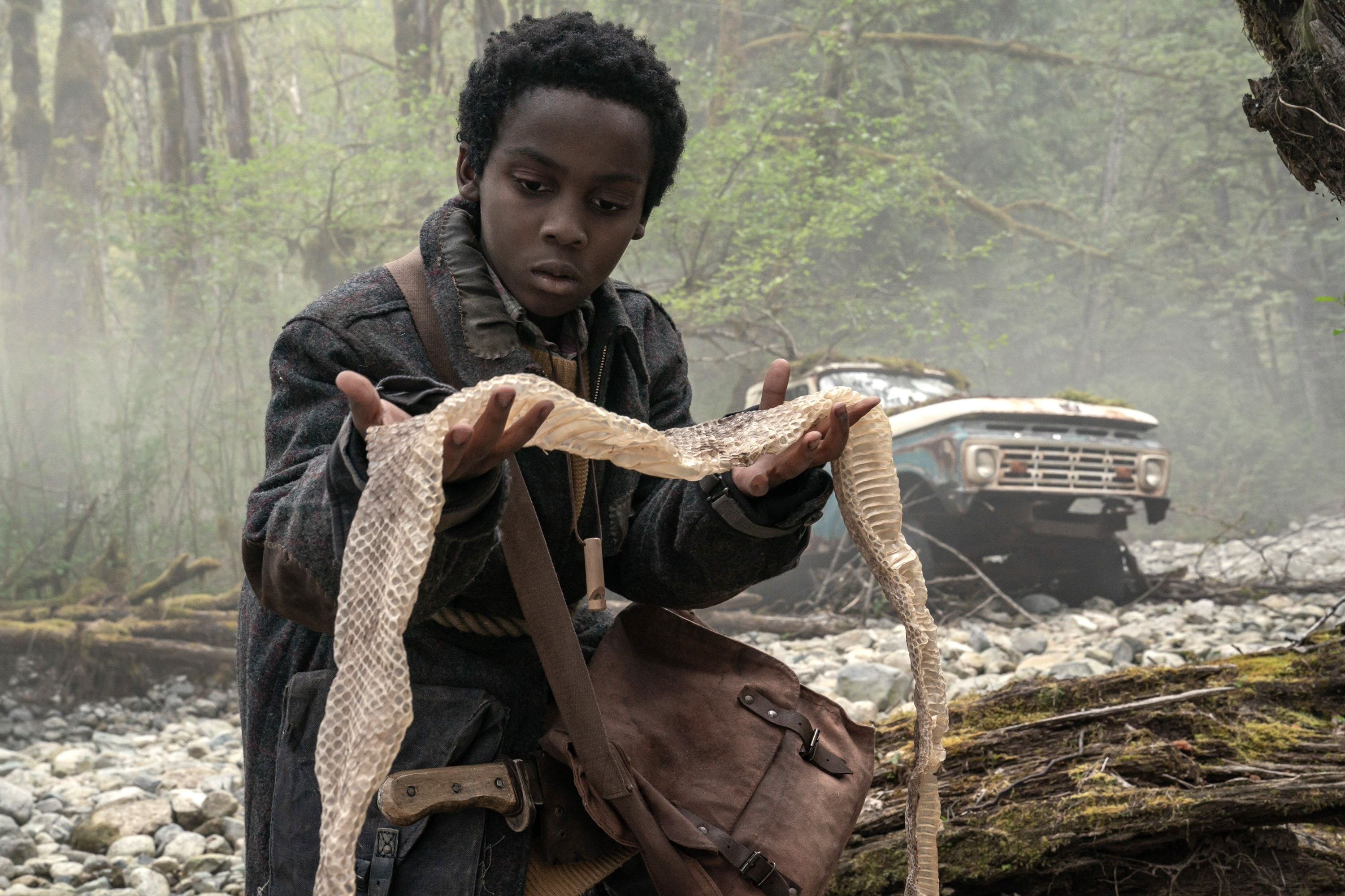 Anthony B. Jenkins holding snake skin in "Never Let Go"