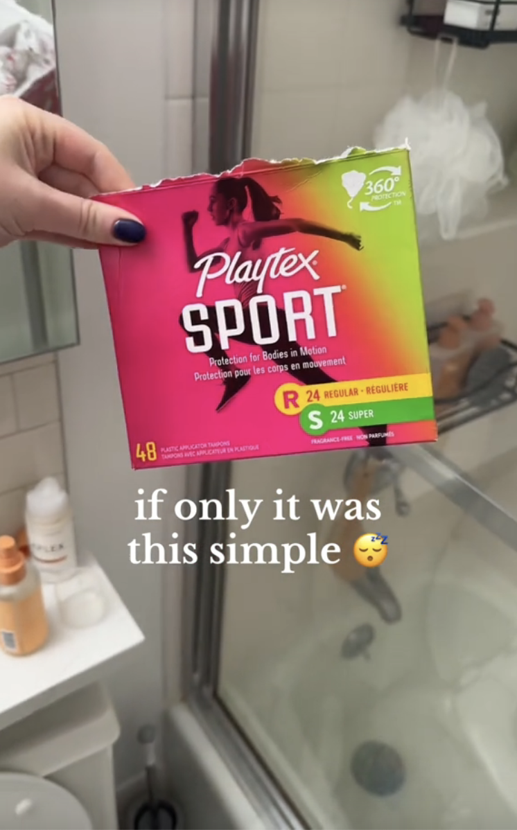 A hand holds an open box of Playtex Sport tampons next to a shower. Text reads, "if only it was this simple."