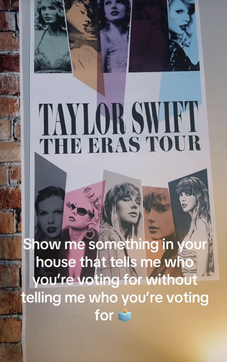 A Taylor Swift "The Eras Tour" poster is displayed on a wall. The image includes text saying, "Show me something in your house that tells me who you're voting for without telling me who you're voting for."