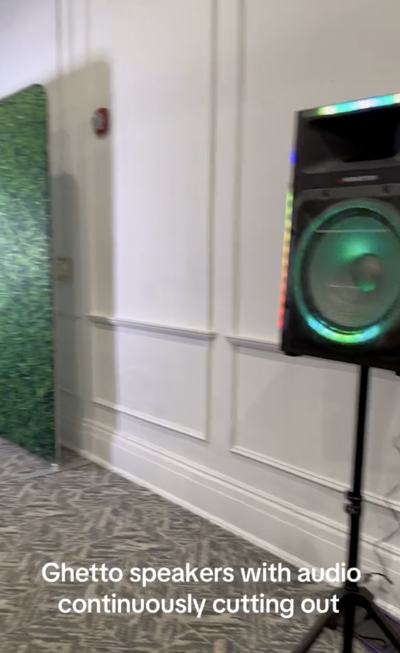 Speaker on a stand in a room; text reads, "Ghetto speakers with audio continuously cutting out"