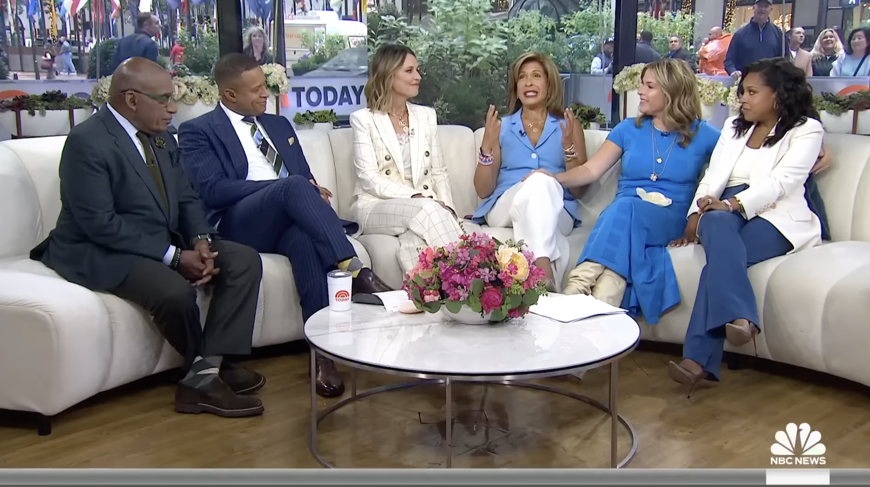 Al Roker, Craig Melvin, Savannah Guthrie, Hoda Kotb, Jenna Bush Hager, and Sheinelle Jones sit together on a couch, engaged in conversation on NBC's Today show