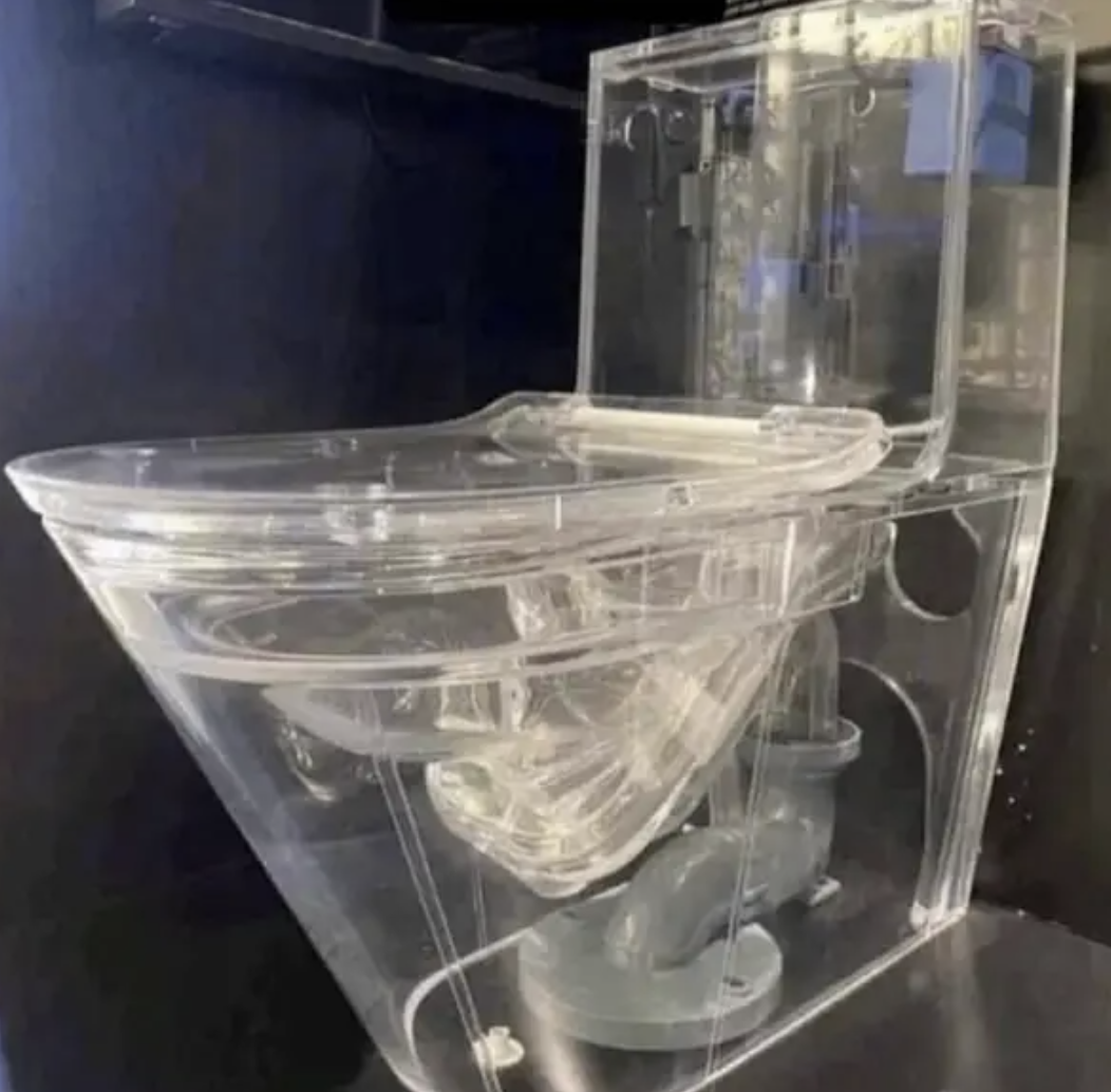 A transparent toilet showcasing its internal workings, featured in an Internet Finds article