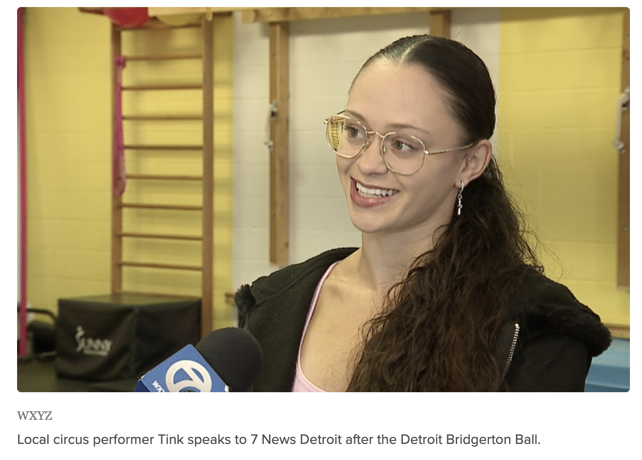 Tink speaks to 7 News Detroit in an interview after the Detroit Bridgerton Ball. She is wearing a dark jacket and glasses