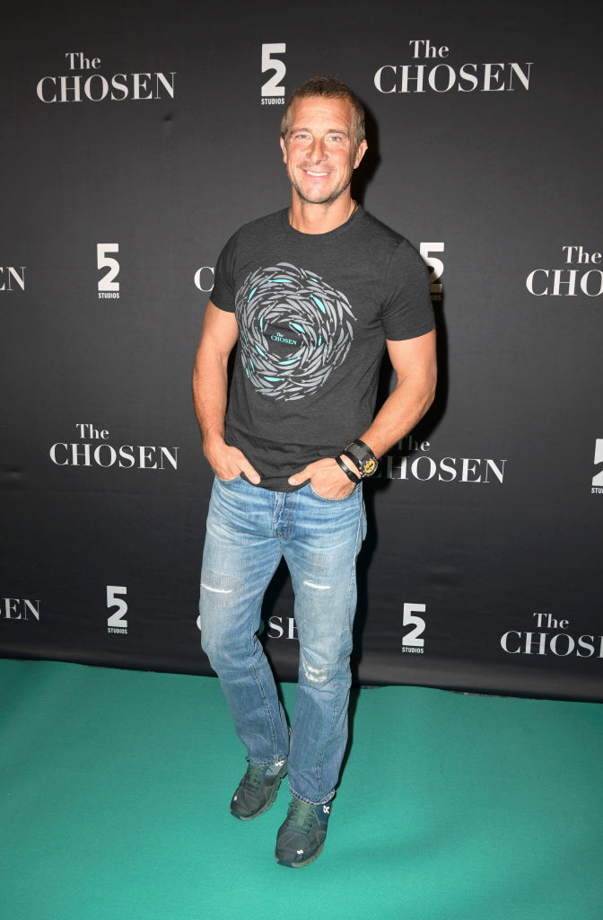 Man in t-shirt and jeans on the red carpet at &quot;The Chosen&quot; event backdrop