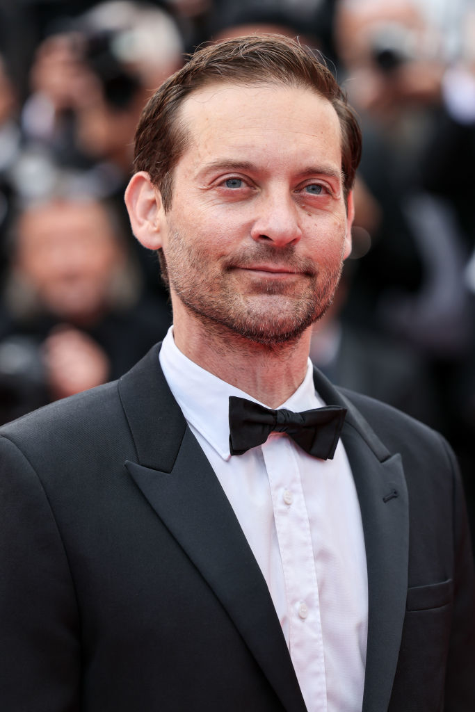 Tobey Maguire in a black tuxedo with bow tie, attending a formal event