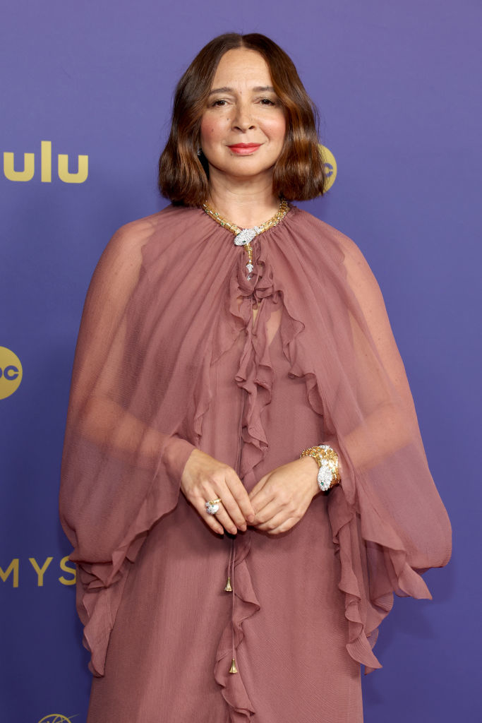 Maya Rudolph wearing a flowy, ruffled gown on the red carpet at an event