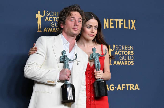 Jeremy Allen White and Molly Gordon pose with awards at the Screen Actors Guild Awards