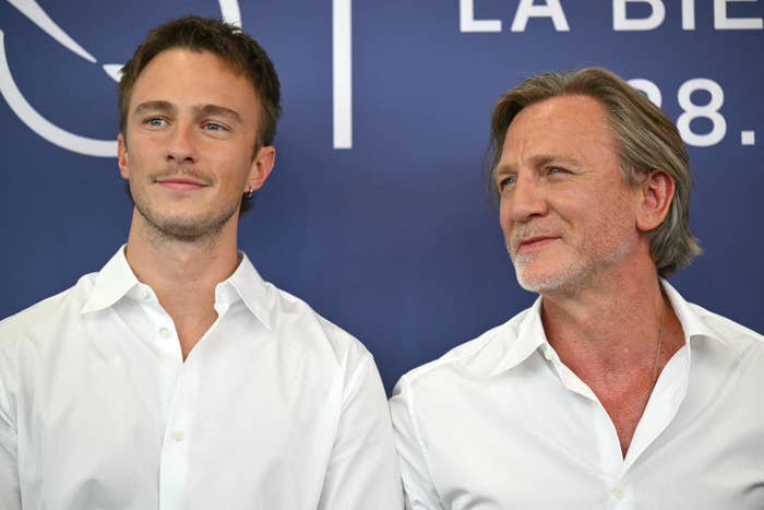 Daniel and Drew stand side by side at an event