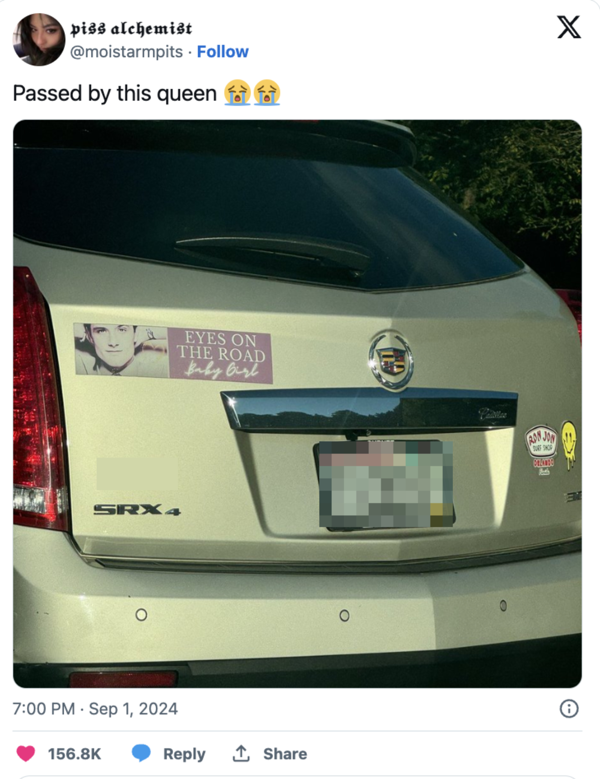 Back of a car with license plate "FAZBEAR," a bumper sticker of Freddie Mercury with "Eyes on the Road Baby Girl," and a "Yes I'm a Jedi" sticker
