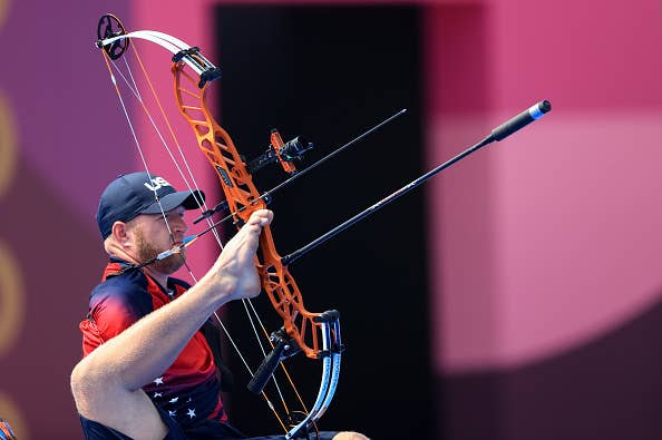 Matt Stutzman, an archer without arms, uses his feet to aim a compound bow during a competition