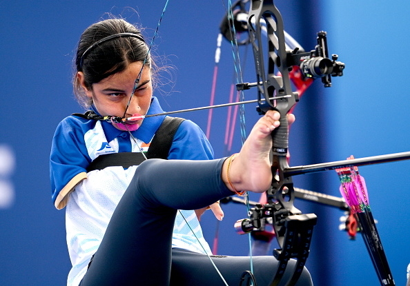 Paralympic archer Zahra Nemati draws her bowstring with her mouth and aims using her feet during a competition