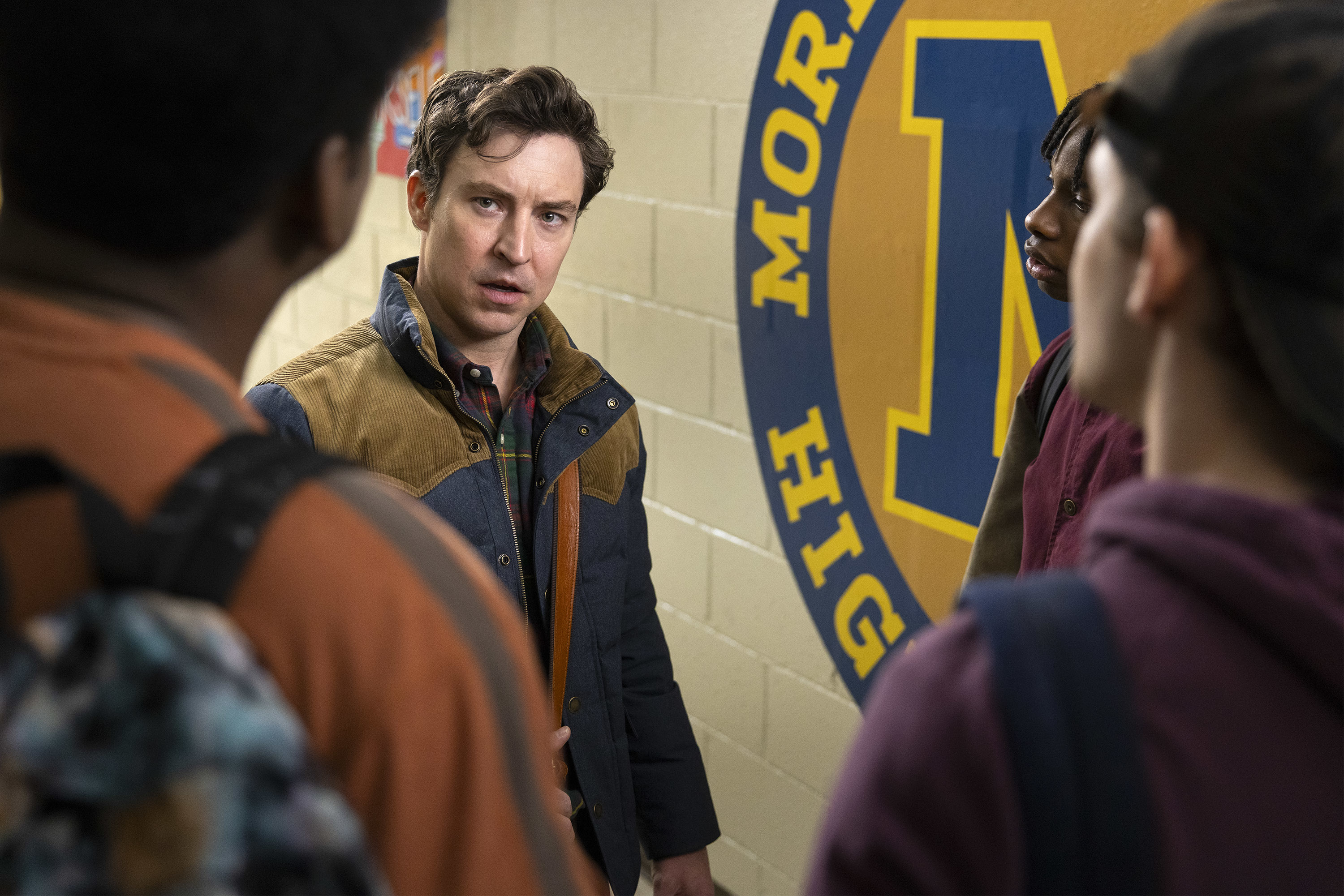 Brian Jordan Albarez as Evan standing a school's hallway in an episode of "English Teacher"