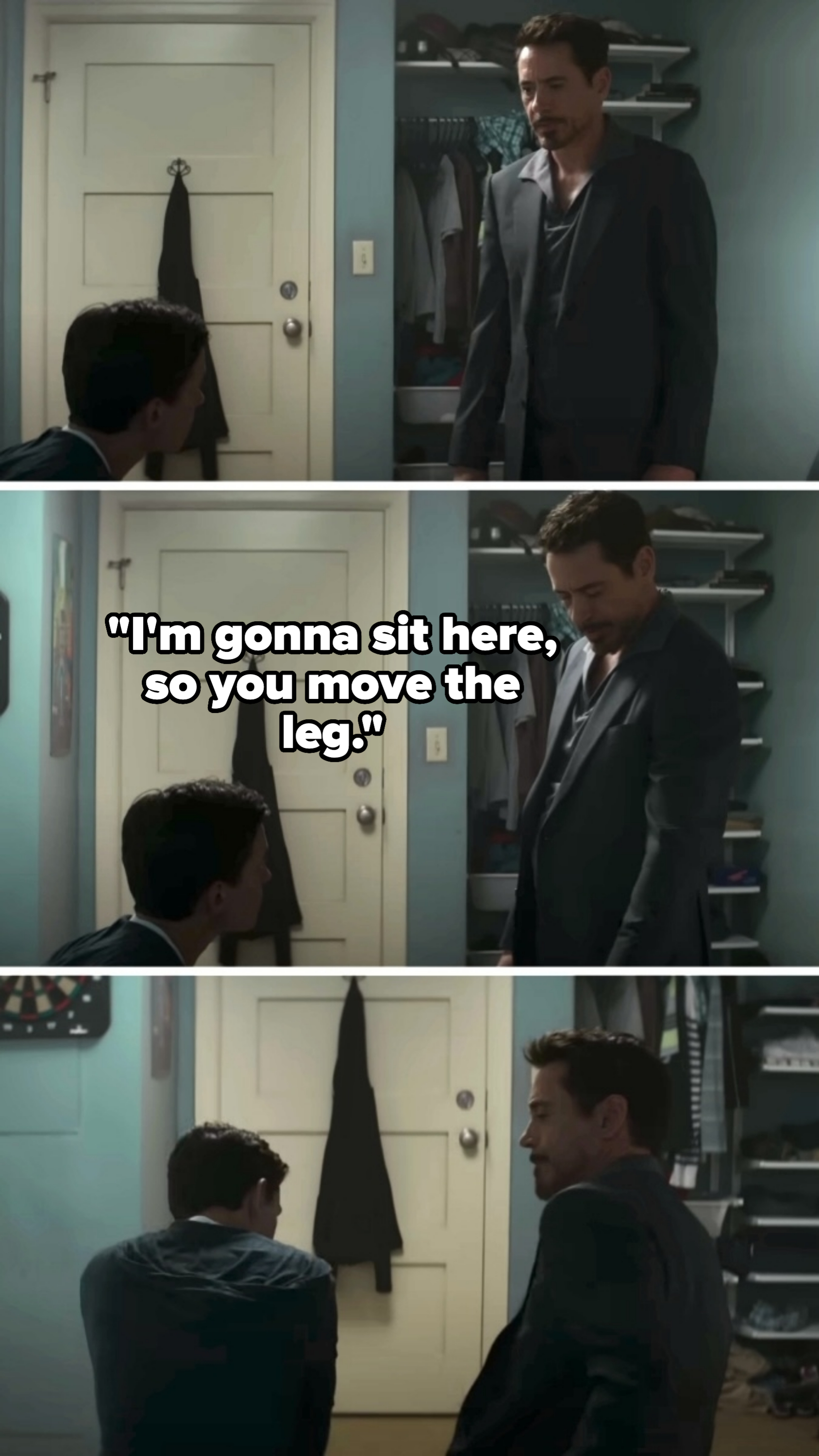 Robert Downey Jr., in a blazer, and Tom Holland in casual wear, are having a conversation in a bedroom with an open closet in the background