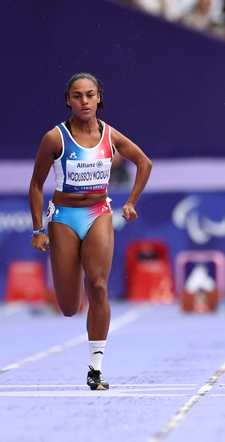 Marie Ngoussou sprinting on a track