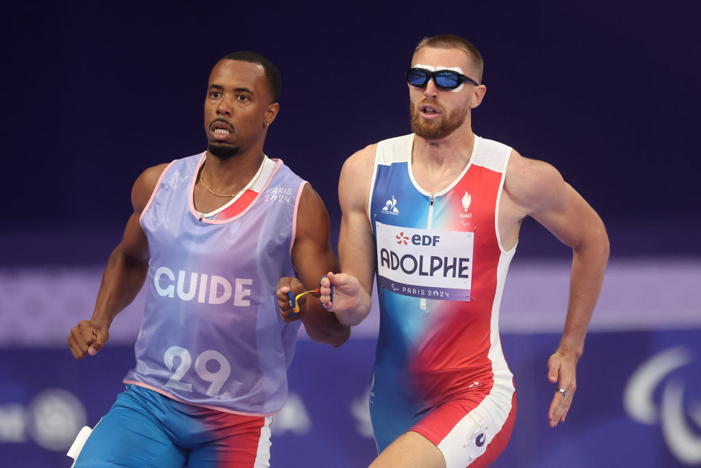 Timothee Adolphe and his guide Jeffrey Lami running