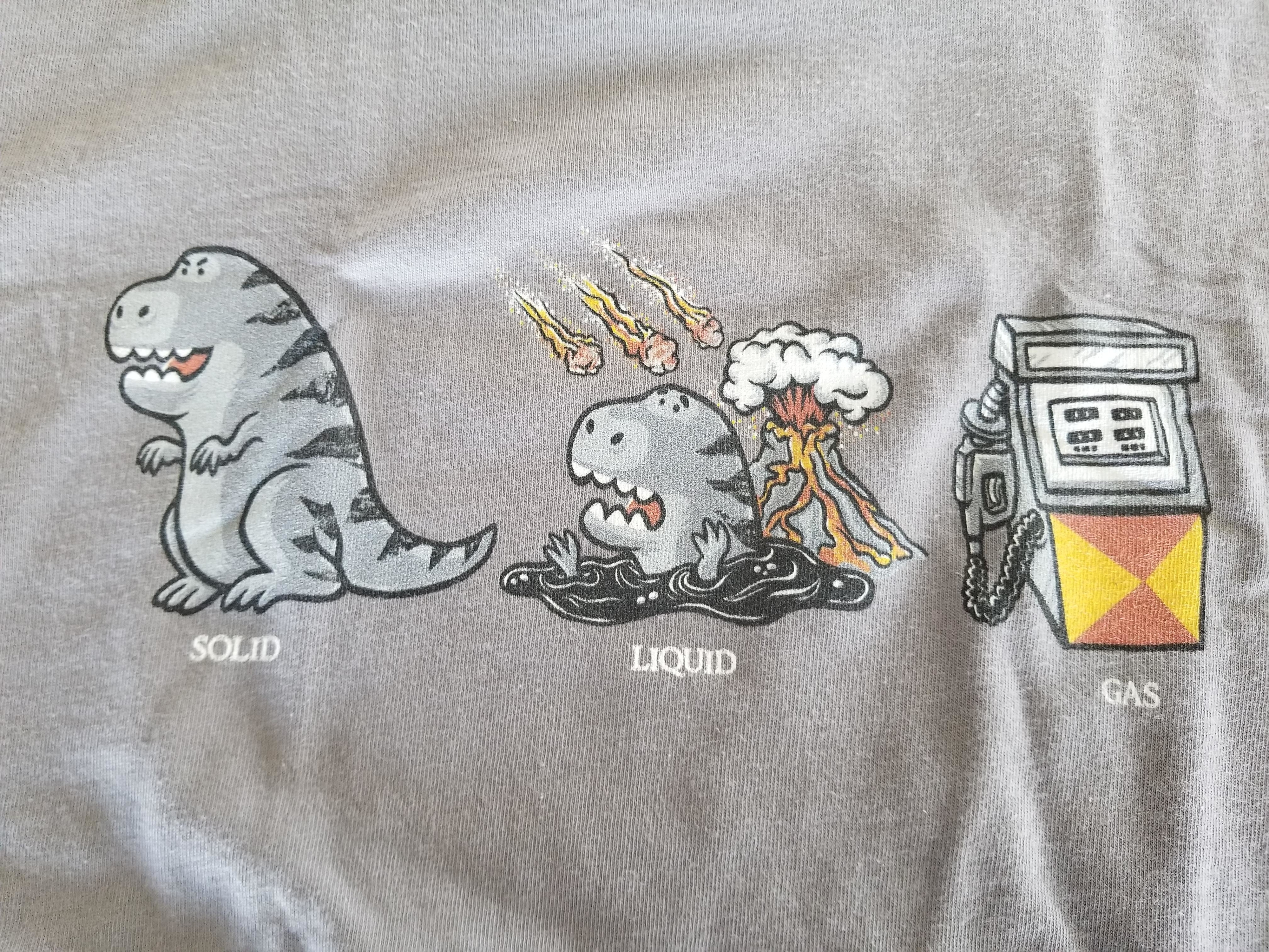 Illustration of a dinosaur and the states of matter: solid, liquid, and gas. The dinosaur is shown solid, melting with an explosion (liquid), and becoming gas near a gas pump