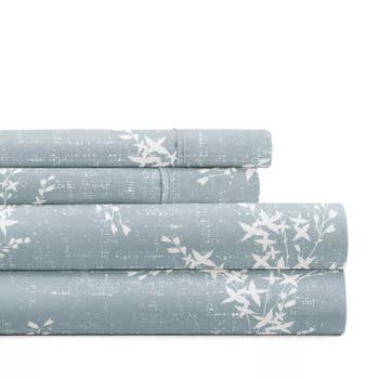 A neatly folded bluish furniture expanse acceptable with a achromatic floral signifier is displayed. The representation is utilized successful an nonfiction categorized arsenic Shopping